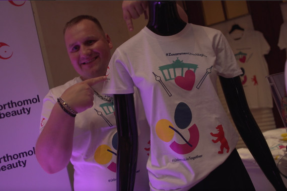 Footage von der Fashion Show und vom T-Shirt-Stand der Special Olympics.